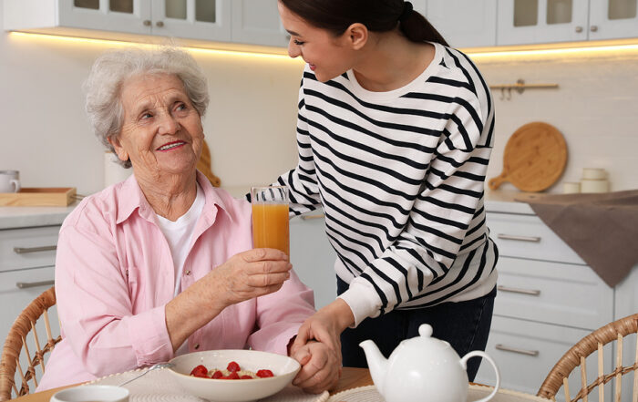 Family visiting older parent receiving in-home senior care.