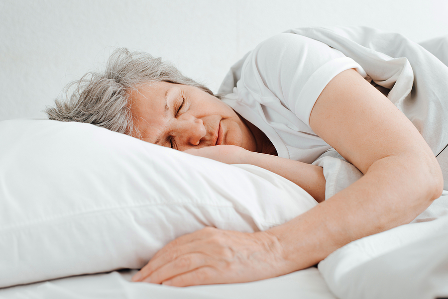 Senior Caucasian Woman Sleeping In Comfortable Bed, Relaxing In Senior Caucasian Woman Sleeping In Comfortable Bed, Relaxing In