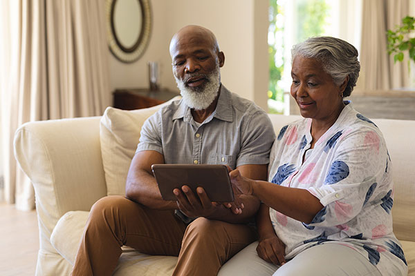 Elderly couple using a laptop