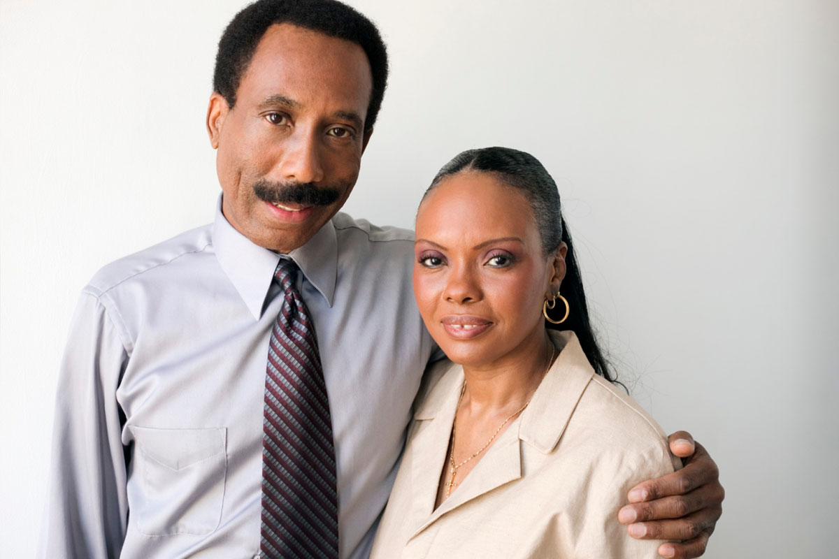 African American Man And Woman Working Together