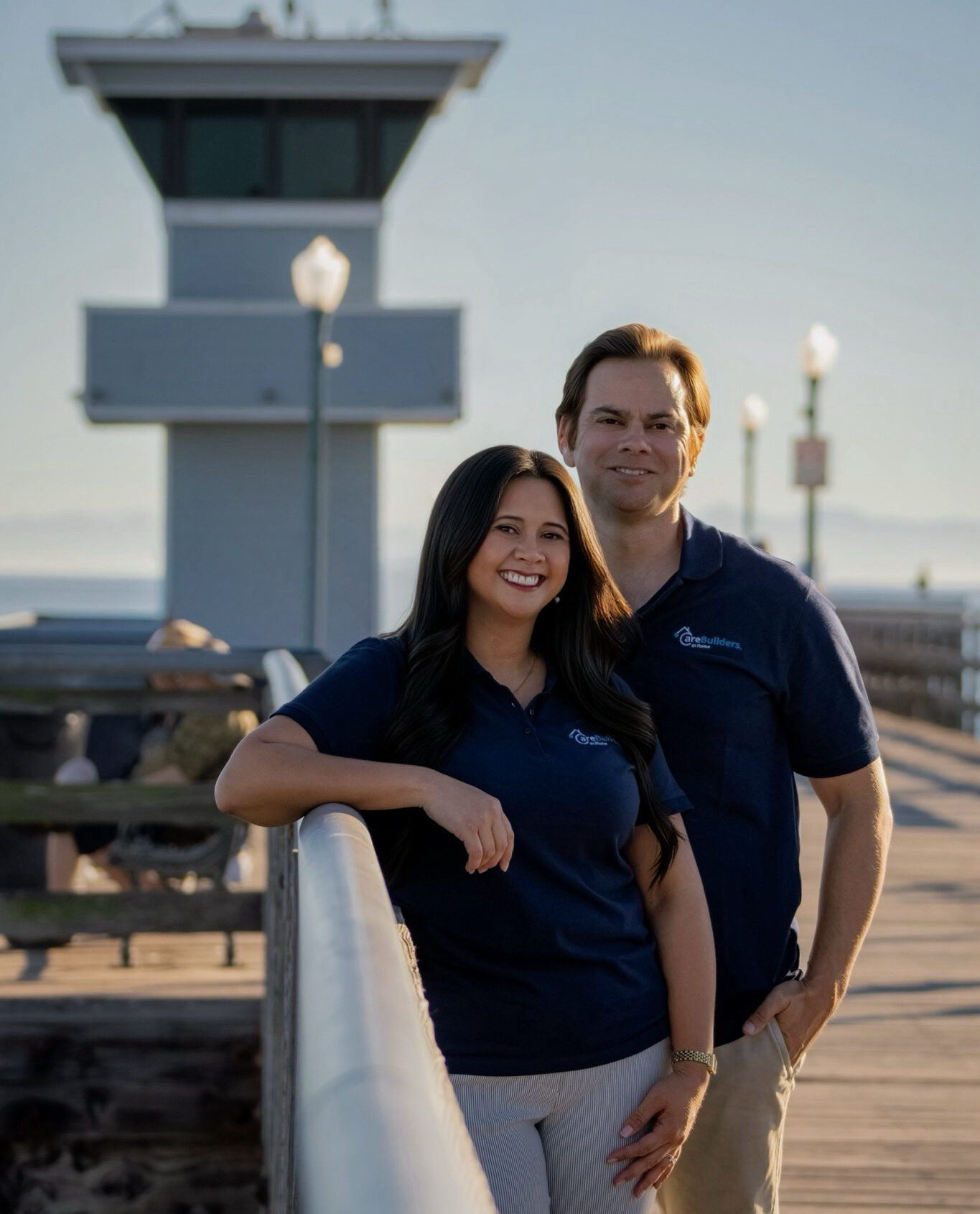 Briones Gjellstad Owner Photo Photo of Aaron and JamieRose standing together on a dock