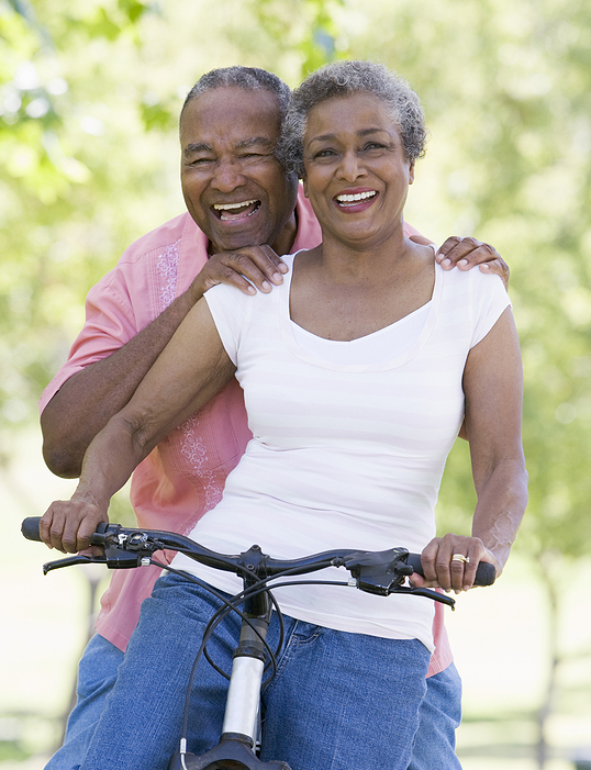 Senior Couple On A Bicycle