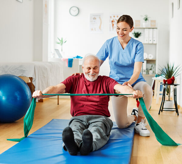 happy caregiver and patient exercising